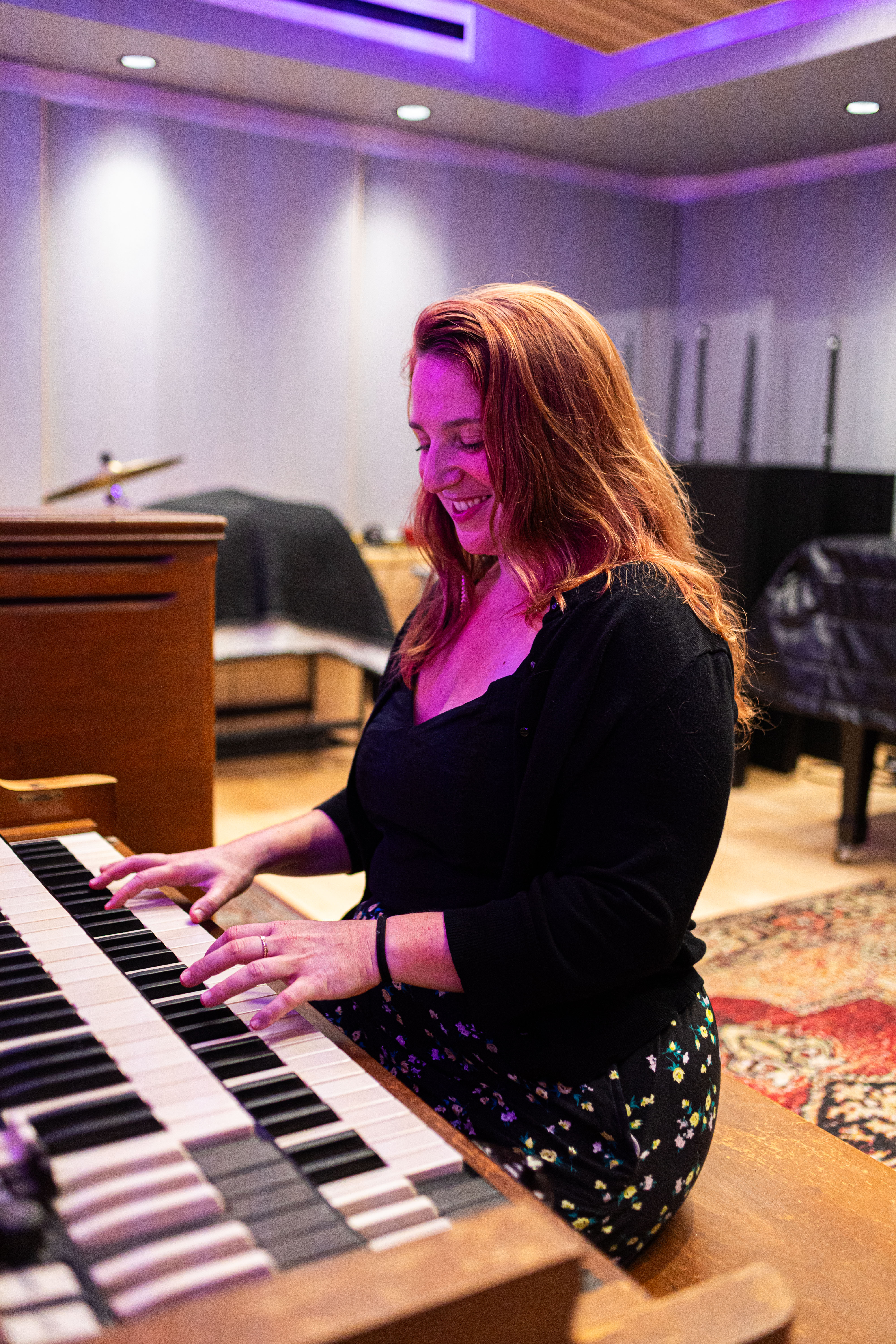 Justina laughing at the piano